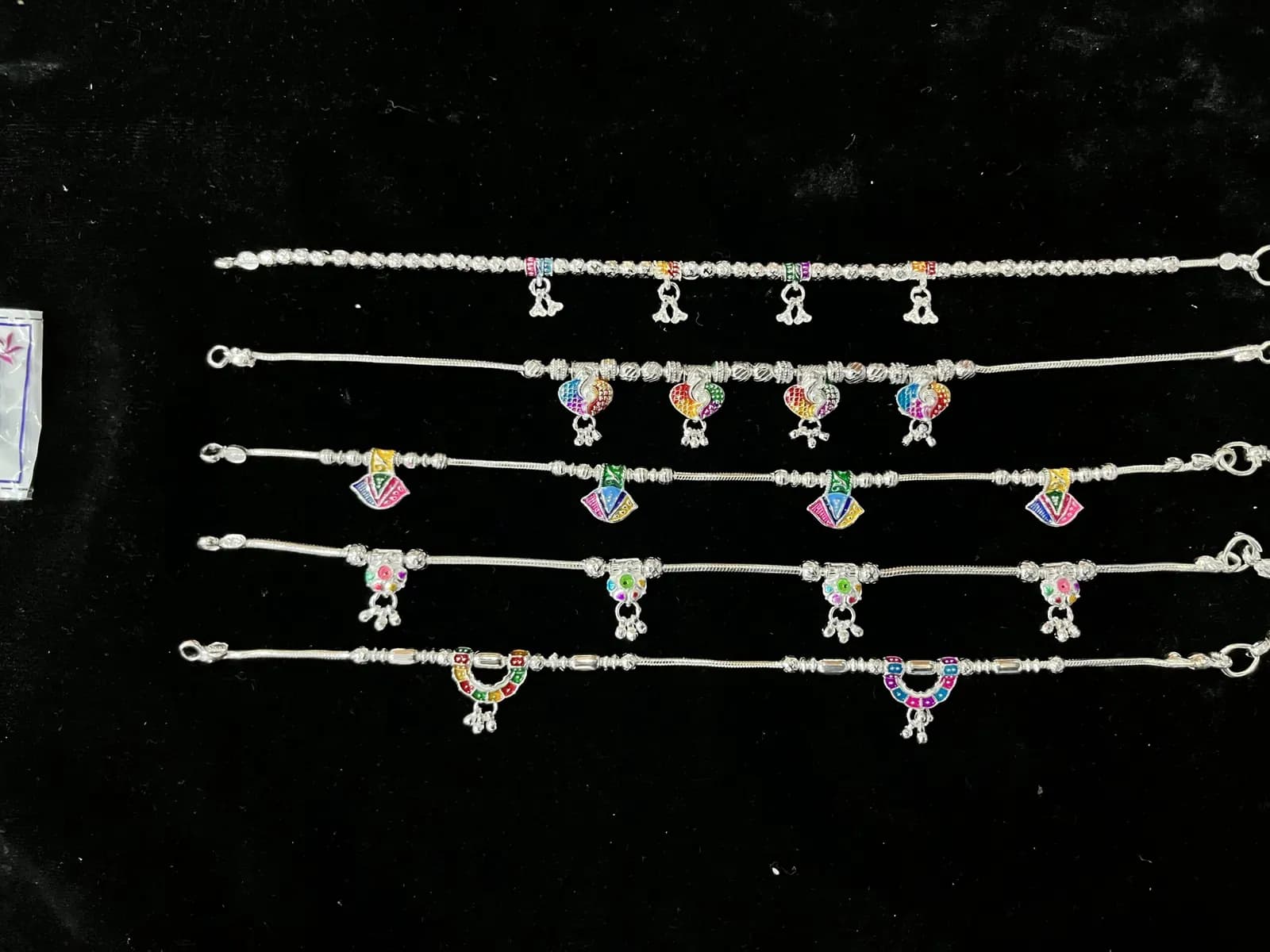 A row of matching silver payal ready for a wholesale order